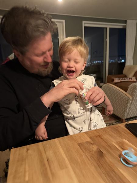 An adult and a child are captured in a joyful moment indoors at Marcantilaan, West, Amsterdam